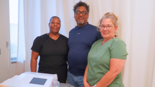  picture of three health science teachers at EKG certification training